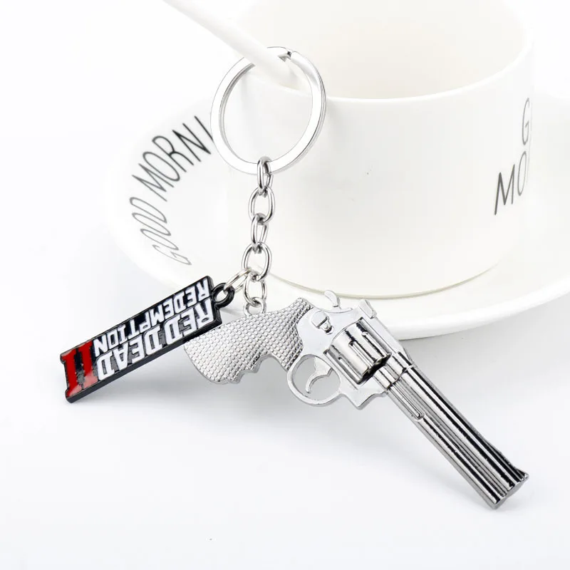 S5d35bdef0e944c92a35b38fc22fd47ef6 - Red Dead Redemption 2 Keychain Men Cosplay Game Gun Pendant Car Key Rings Metal Key Accessories Key Props Bag Jewelry Fans Gift