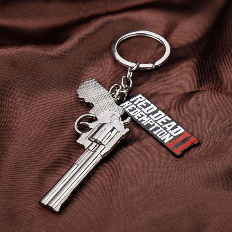 Sd15a4a7779434e3b92cf65e6f725e890f - Red Dead Redemption 2 Keychain Men Cosplay Game Gun Pendant Car Key Rings Metal Key Accessories Key Props Bag Jewelry Fans Gift