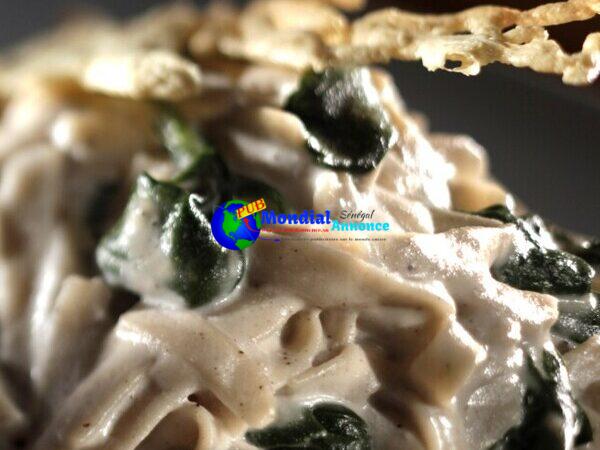 Cashew cream fettuccine Alfredo with sauteed spinach and cheese crisps (gluten-free)