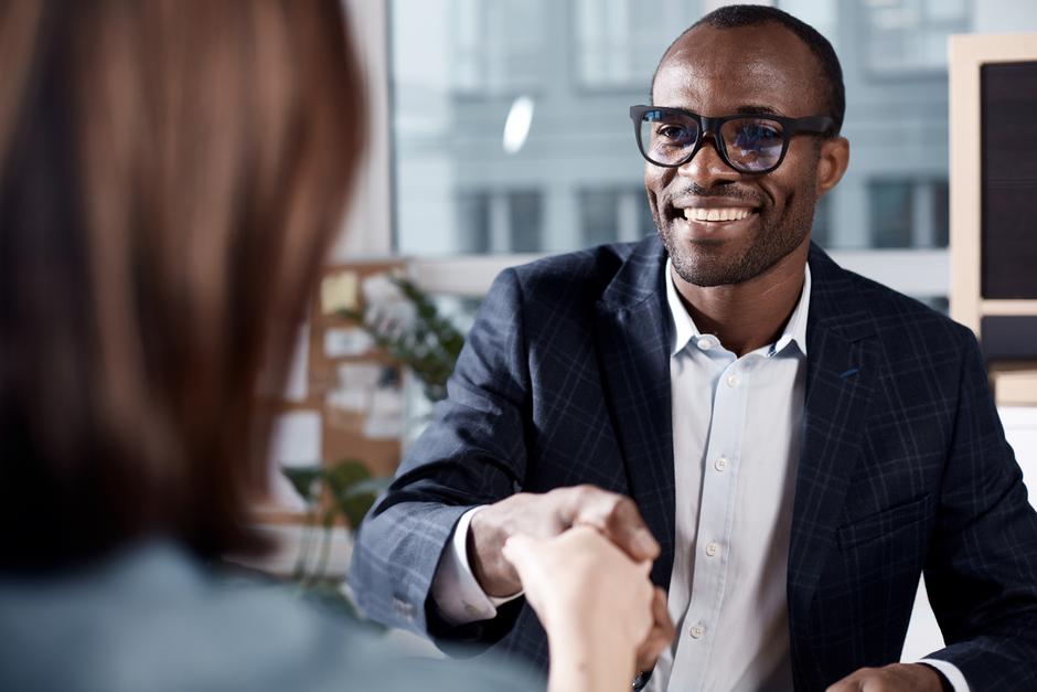 Man shaking hand interview resized - job